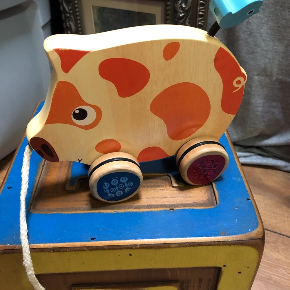 Wooden pig pull toy.